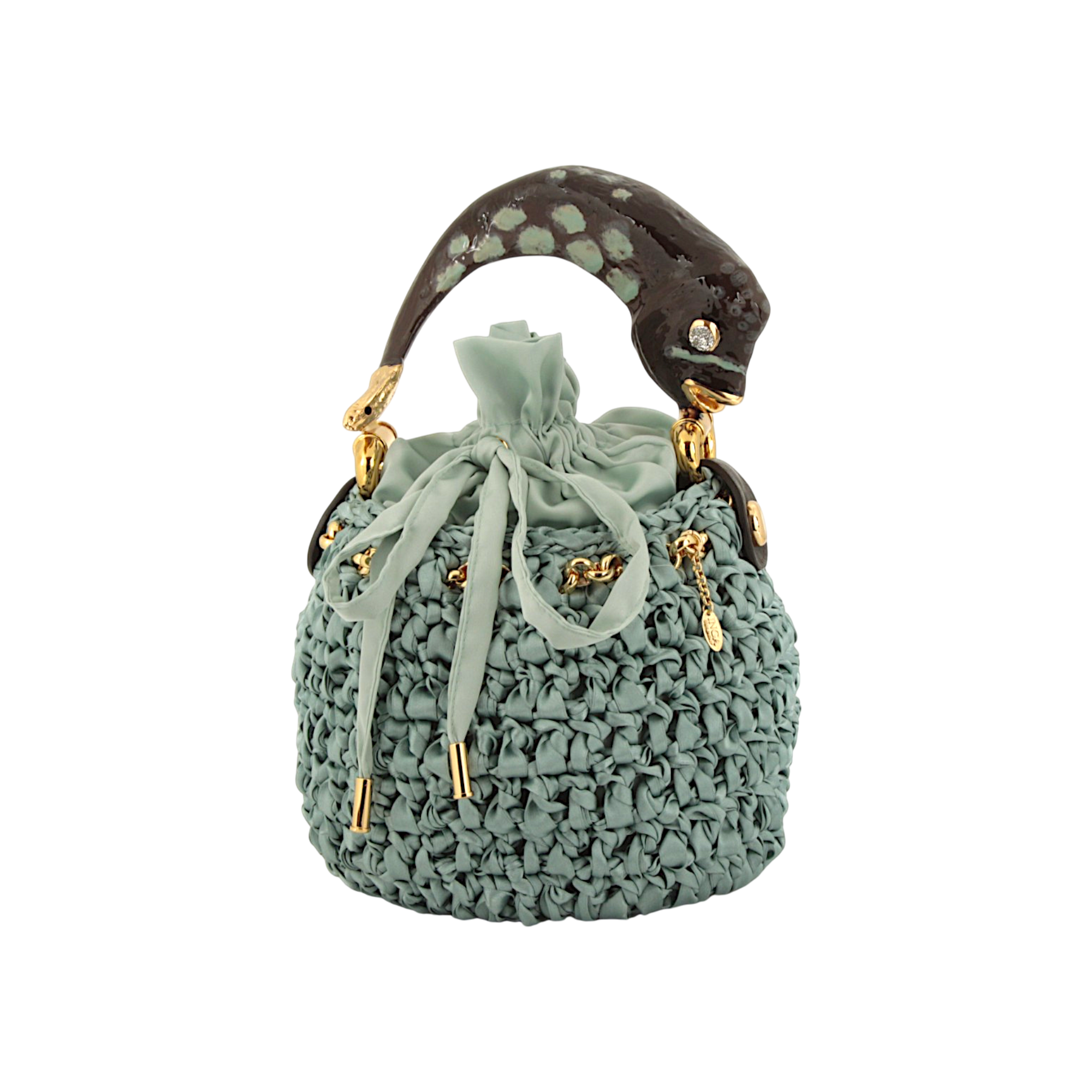 Bucket bag with fish sculpture handle in crocheted satin
Elegant bucket bag in crocheted satin with sculptural fish handle
Artisanal bucket bag with fish handle and textured crocheted satin body by Inga Sirmione