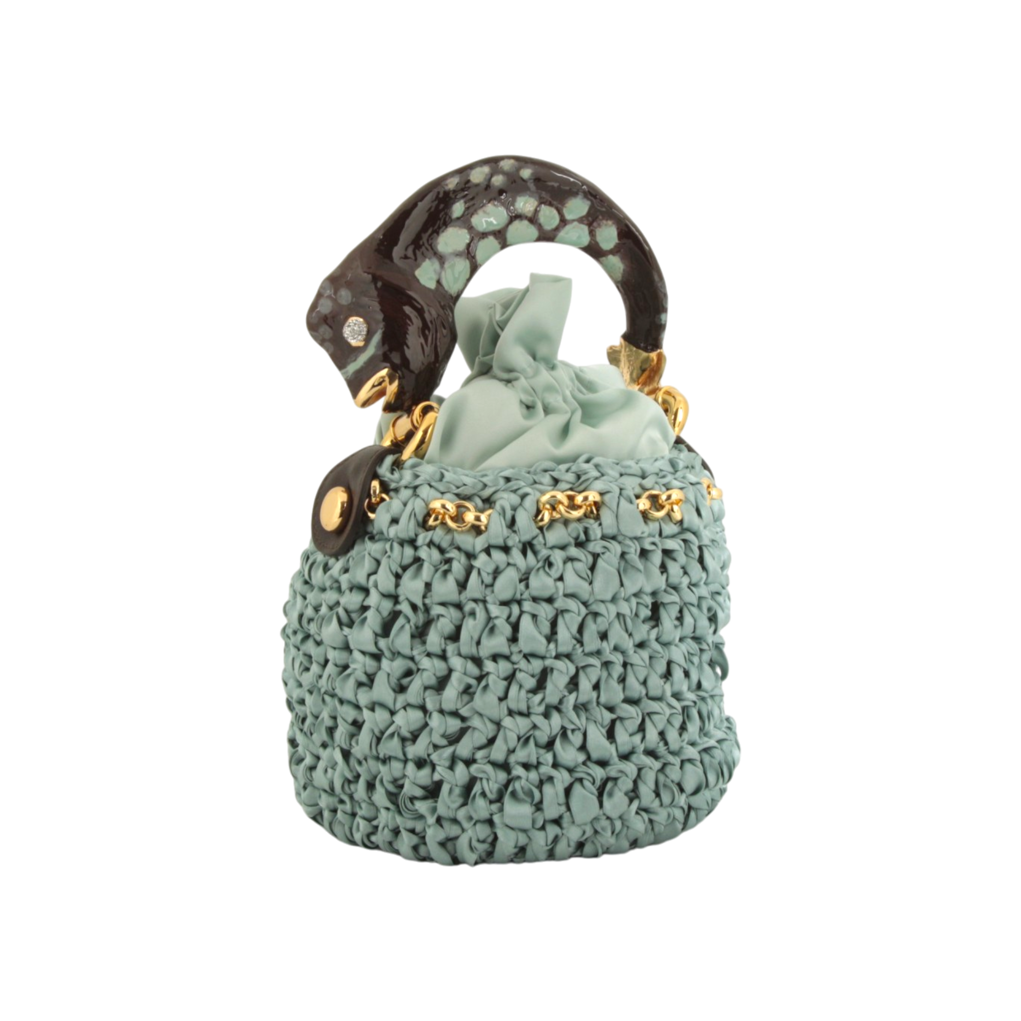 Bucket bag with fish sculpture handle in crocheted satin
Elegant bucket bag in crocheted satin with sculptural fish handle
Artisanal bucket bag with fish handle and textured crocheted satin body by Inga Sirmione
