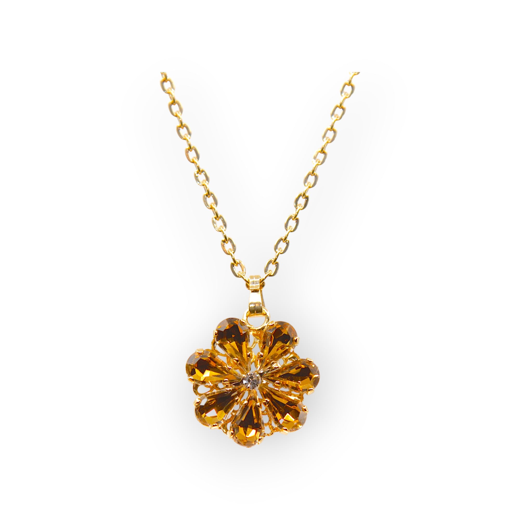 Daisy Pendant Necklace With Crystal Drops In amber and topaz shades.