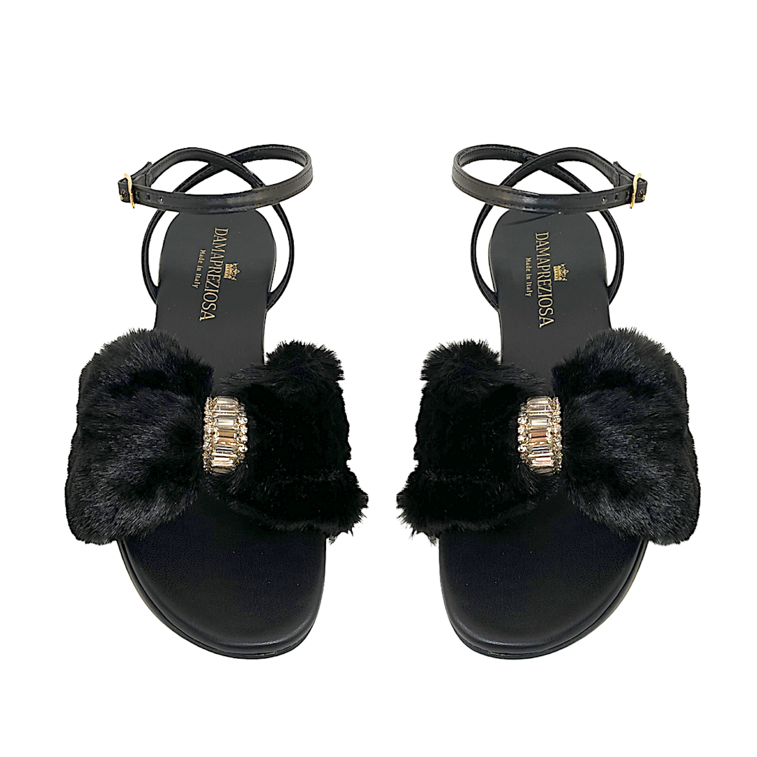 Black vegan faux fur and vegan leather. Embellished with white crystals. Elegant padded insoles in soft black vegan leather to add the comfort you deserve. 5 cm heel covered in black vegan leather. Damapreziosa logo engraved on soles and insoles. Glittery sole. PETA approved vegan product