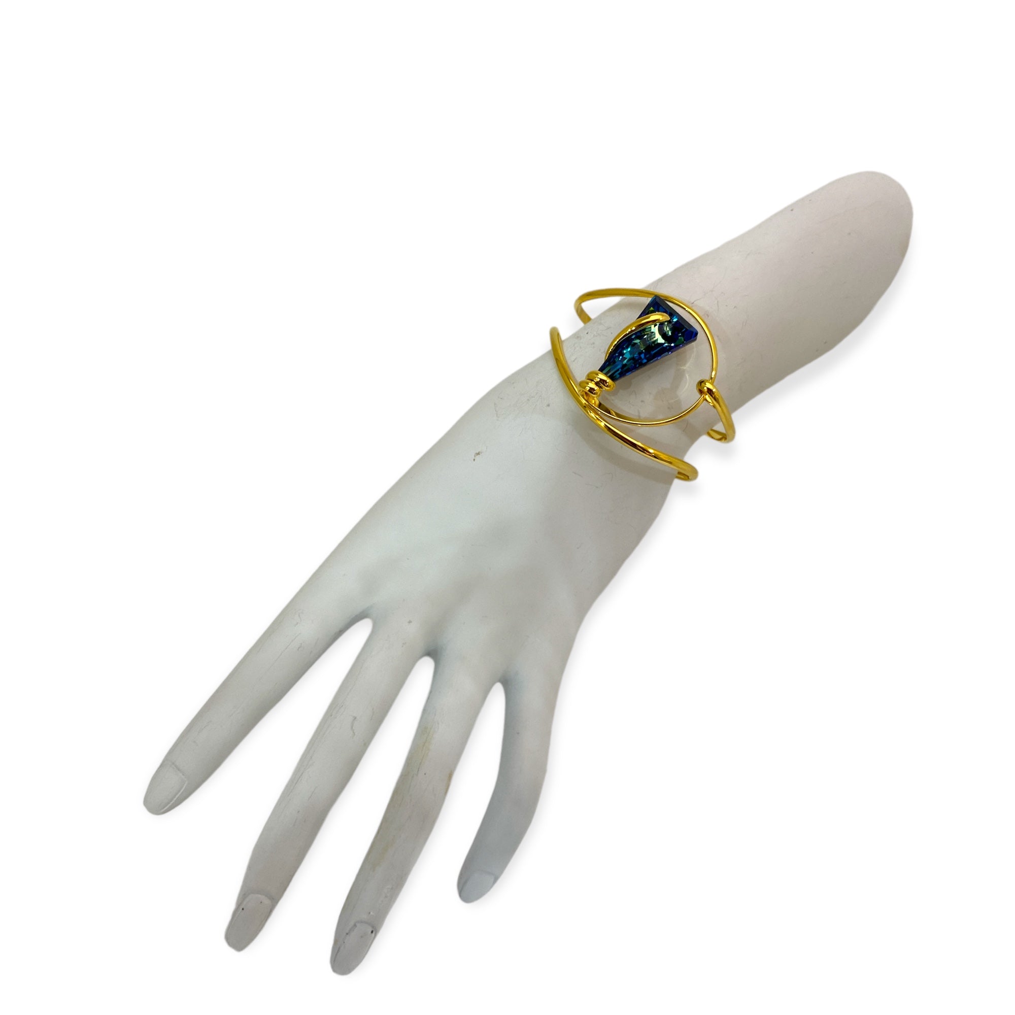 A precious crystal inspires the unique design of these extraordinary bracelet realized in 24 Kt Gold Plating metal.