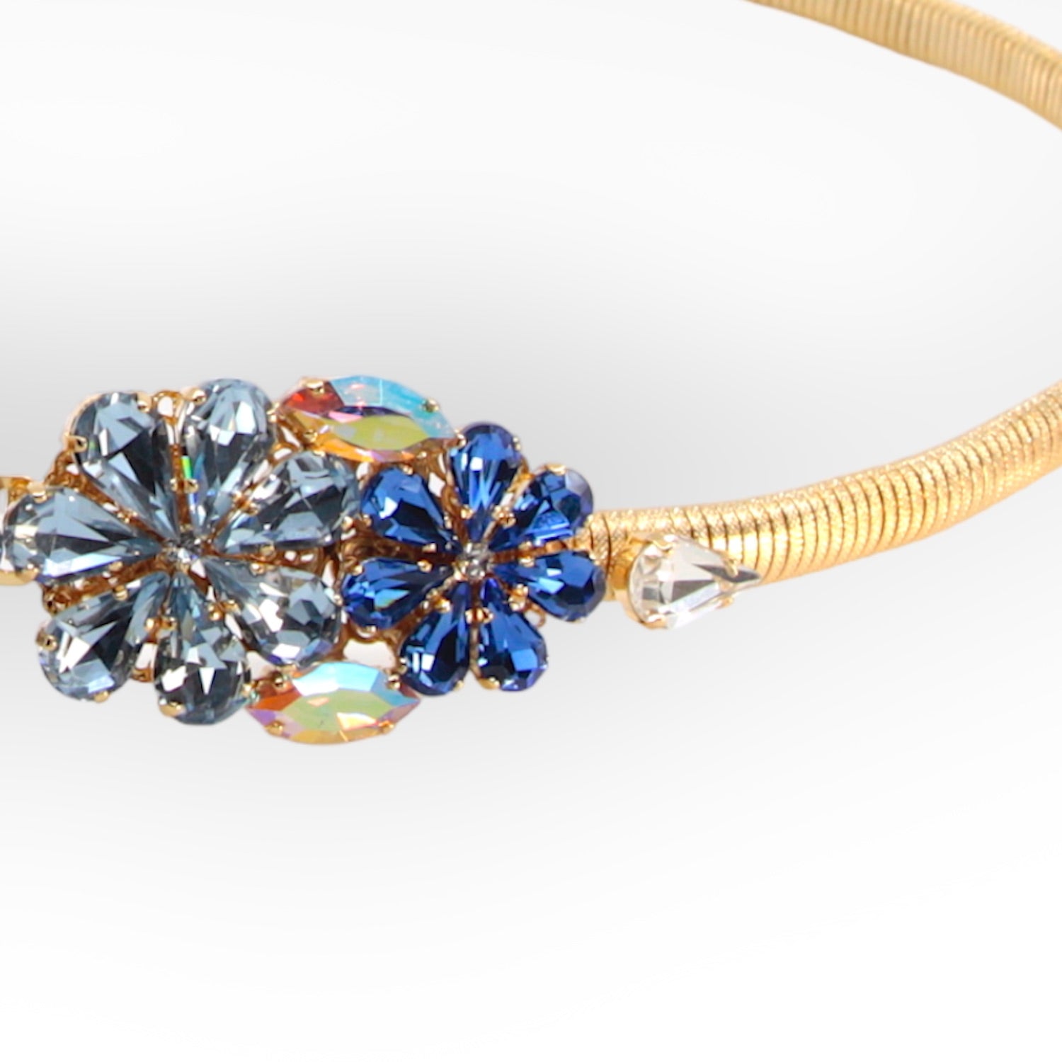 GOLD PLATED STRETCH METAL BELT WITH DAISY BUCKLE IN SAPPHIRE AND AQUAMARINE CRYSTALS