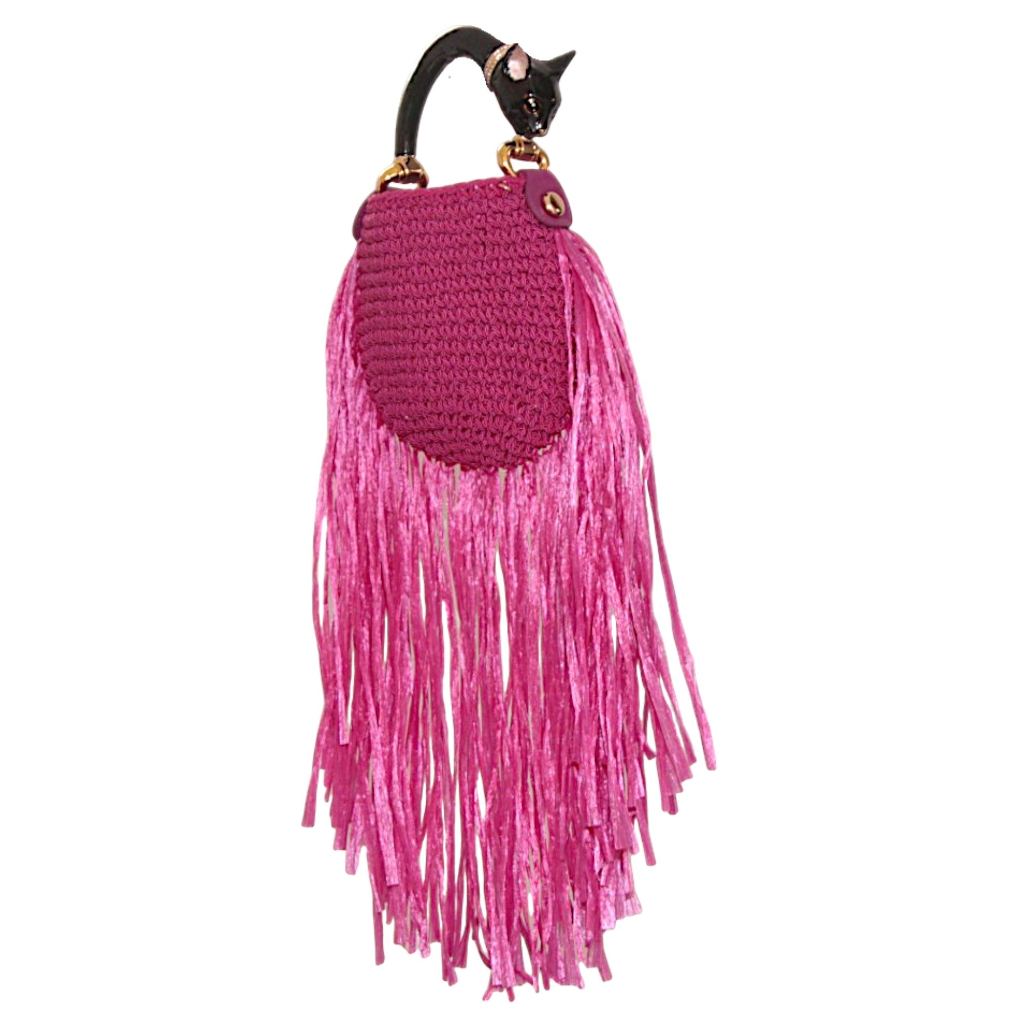 Fuchsia woven bag with dramatic fringes and sculptural black cat handle featuring hand-painted enamel and 24k gold-plated details. Saint Tropez Collection.
