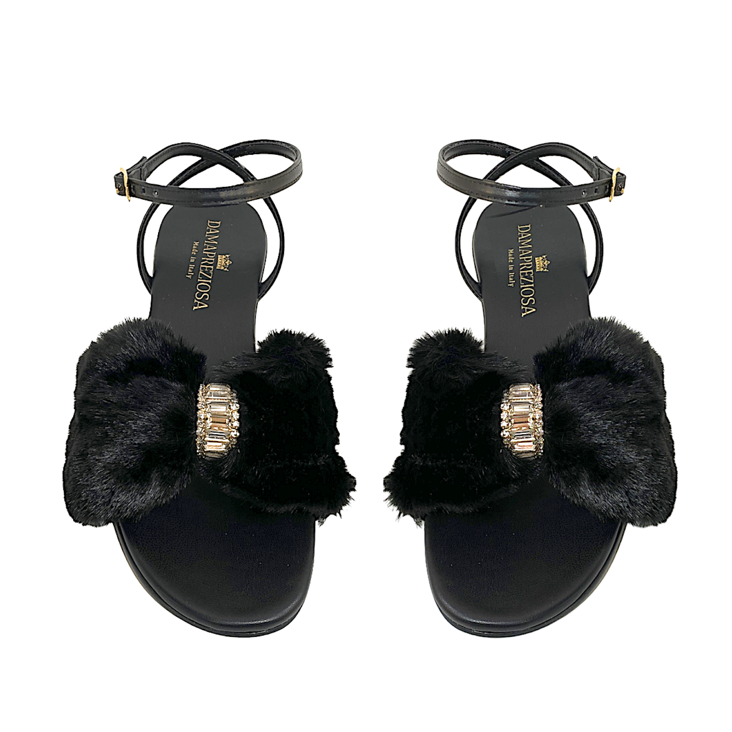 Black vegan faux fur and vegan leather. Embellished with white crystals. Elegant padded insoles in soft black vegan leather to add the comfort you deserve. 5 cm heel covered in black vegan leather.  Damapreziosa logo engraved on soles and insoles. Glittery sole.  PETA approved vegan product