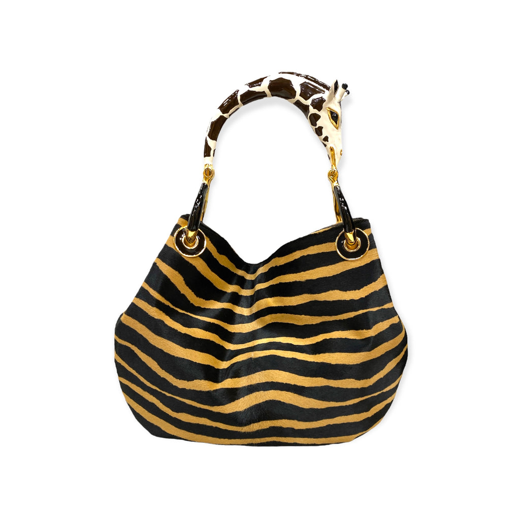 GIRAFFE SMALL BAG WITH PONY-HAIR PRINT LUXURY HANDBAGS COLLECTION Creart2 Made in Italy Precious handbag made in Italy with fine accessories made in polychrome enamels and exclusive hides, every bag is the result of an accurate handcraft manufacture that makes it unique. The "sculpture" handle is made of metal with 24 Kt Gold Plated parts and the enamel is…